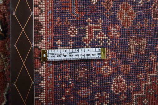 Surface texture of 2000s Shiraz rug with natural Wool and intricate pattern