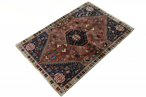 Corner detail of 2000s Shiraz rug showing border pattern and Wool pile
