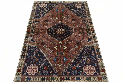 Surface texture of 2000s Shiraz rug with natural Wool and intricate pattern
