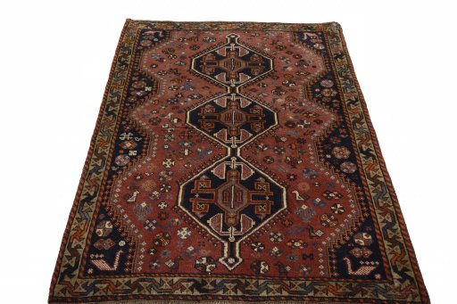 Surface texture of 2000s Shiraz rug with natural Wool and intricate pattern
