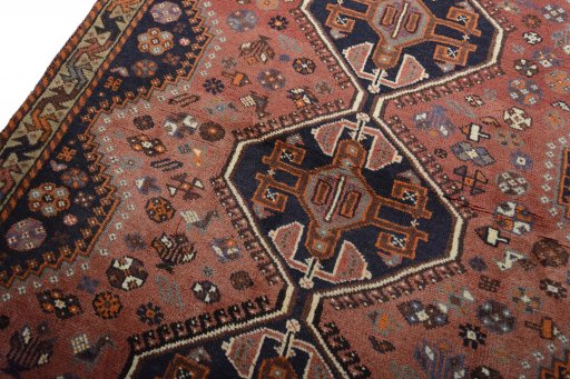 Backside of handmade 2000s Shiraz rug showing knot structure and weave density