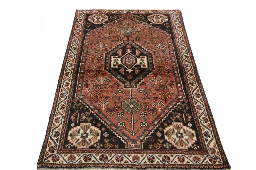 Surface texture of 2000s Shiraz rug with natural Wool and intricate pattern