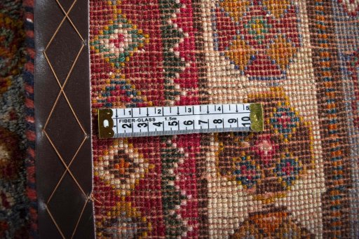Surface texture of 2000s Shiraz rug with natural Wool and intricate pattern