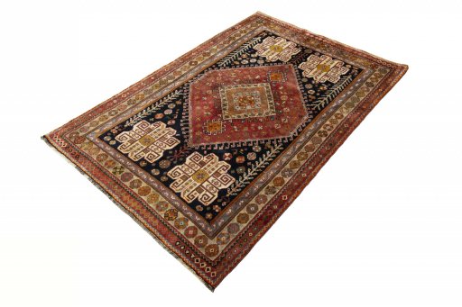 Corner detail of 2000s Shiraz rug showing border pattern and Wool pile
