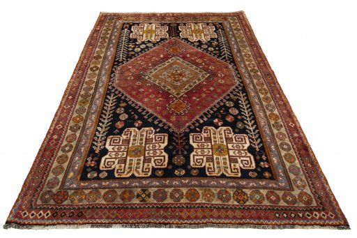 Surface texture of 2000s Shiraz rug with natural Wool and intricate pattern