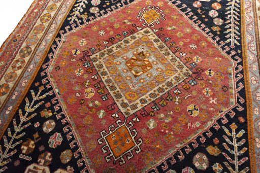 Backside of handmade 2000s Shiraz rug showing knot structure and weave density