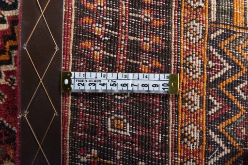 Surface texture of 2000s Shiraz rug with natural Wool and intricate pattern