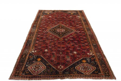 Surface texture of 2000s Shiraz rug with natural Wool and intricate pattern