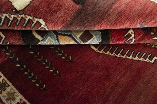 Corner detail of 2000s Shiraz rug showing border pattern and Wool pile