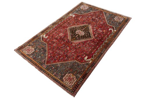 Corner detail of 2000s Shiraz rug showing border pattern and Wool pile