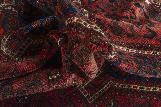 Corner detail of 2000s Shiraz rug showing border pattern and Wool pile