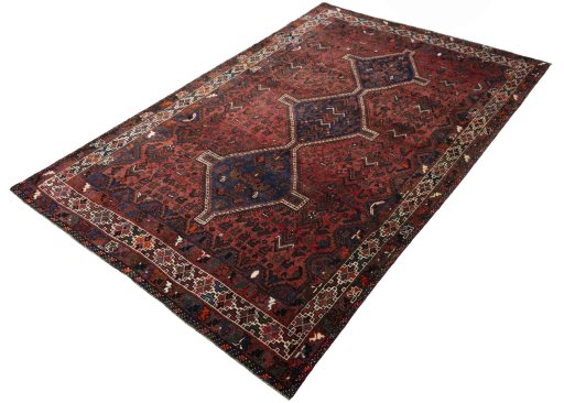 Corner detail of 2000s Shiraz rug showing border pattern and Wool pile