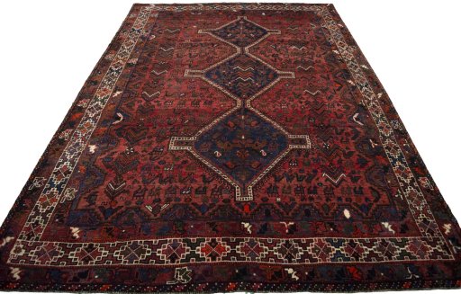 Surface texture of 2000s Shiraz rug with natural Wool and intricate pattern