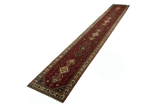 Corner detail of 2000s Shiraz rug showing border pattern and Wool pile
