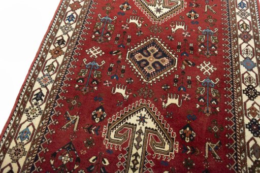 Backside of handmade 2000s Shiraz rug showing knot structure and weave density