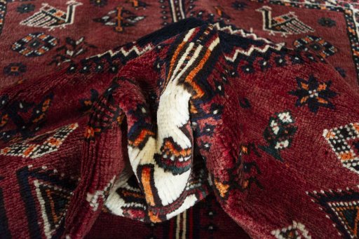 Corner detail of 2000s Shiraz rug showing border pattern and Wool pile