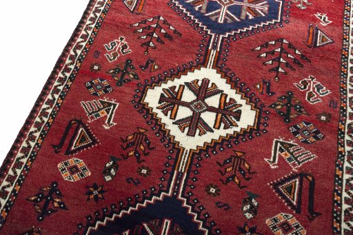 Backside of handmade 2000s Shiraz rug showing knot structure and weave density