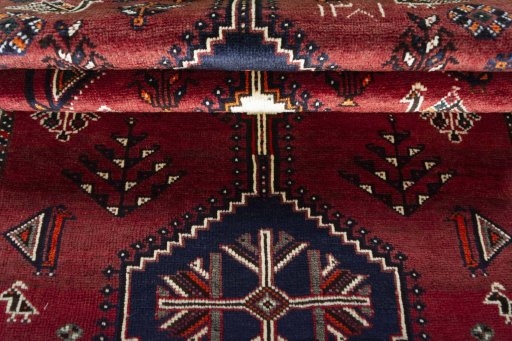 Full view of 2000s Shiraz rug from Iran / Persia, 188 × 107 cm in Red tones