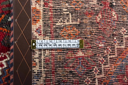 Surface texture of 2000s Shiraz rug with natural Wool and intricate pattern