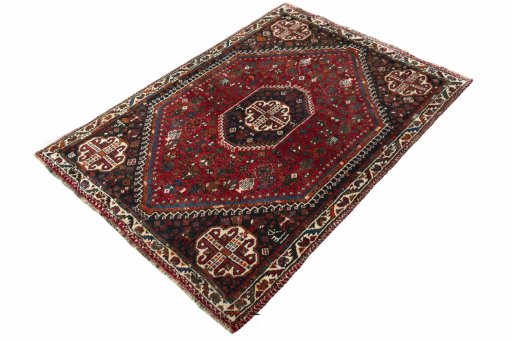 Corner detail of 2000s Shiraz rug showing border pattern and Wool pile