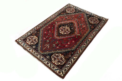 Corner detail of 2000s Shiraz rug showing border pattern and Wool pile