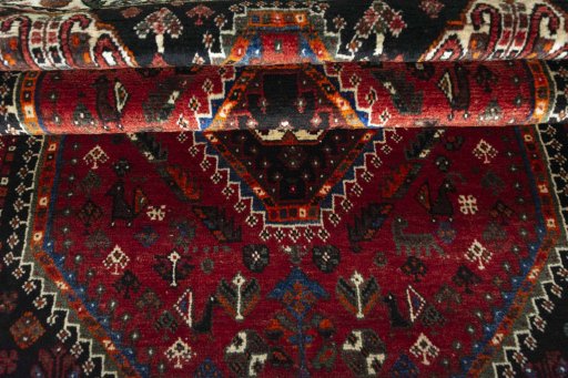 Full view of 2000s Shiraz rug from Iran / Persia, 172 × 112 cm in Red tones