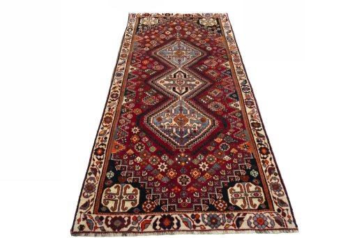 Surface texture of 2000s Shiraz rug with natural Wool and intricate pattern