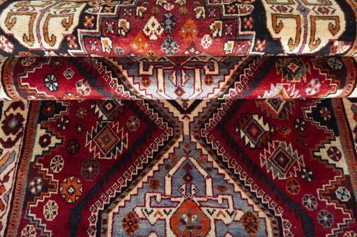 Full view of 2000s Shiraz rug from Iran / Persia, 262 × 106 cm in Red tones
