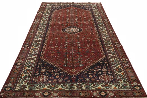 Surface texture of 2000s Shiraz rug with natural Wool and intricate pattern