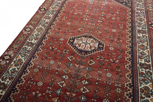 Backside of handmade 2000s Shiraz rug showing knot structure and weave density