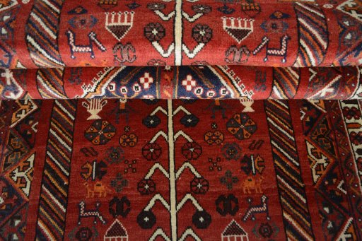 Corner detail of 2000s Shiraz rug showing border pattern and Wool pile