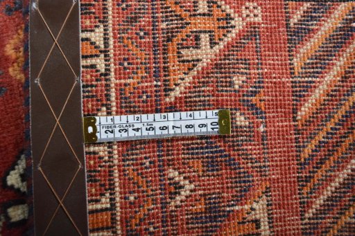 Surface texture of 2000s Shiraz rug with natural Wool and intricate pattern