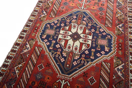 Backside of handmade 2000s Shiraz rug showing knot structure and weave density