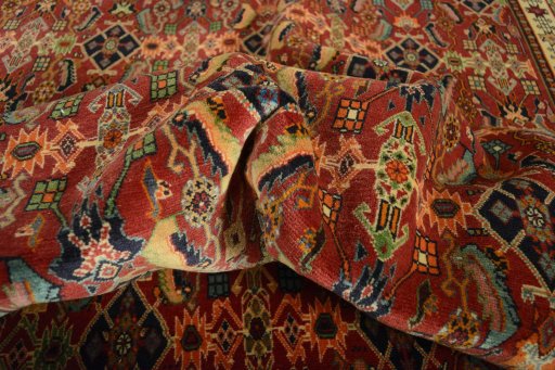 Corner detail of 2000s Shiraz rug showing border pattern and Wool pile