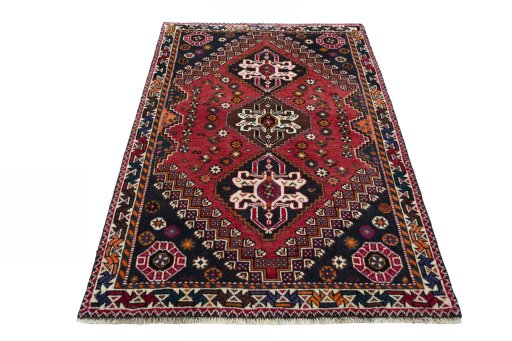 Surface texture of 2000s Shiraz rug with natural Wool and intricate pattern