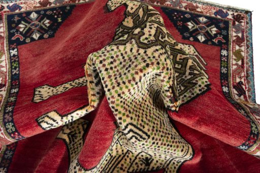 Corner detail of 2000s Shiraz rug showing border pattern and Wool pile