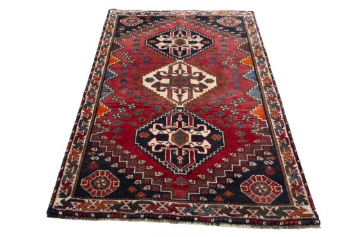 Surface texture of 2000s Shiraz rug with natural Wool and intricate pattern
