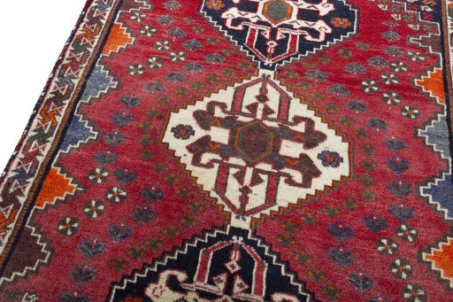 Backside of handmade 2000s Shiraz rug showing knot structure and weave density