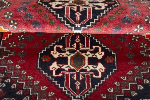 Full view of 2000s Shiraz rug from Iran / Persia, 171 × 115 cm in Red tones