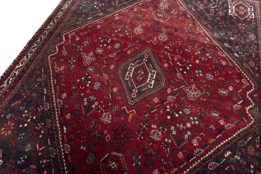 Backside of handmade 2000s Shiraz rug showing knot structure and weave density