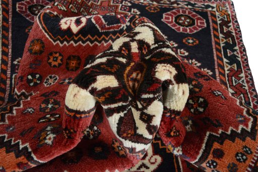 Corner detail of 2000s Shiraz rug showing border pattern and Wool pile