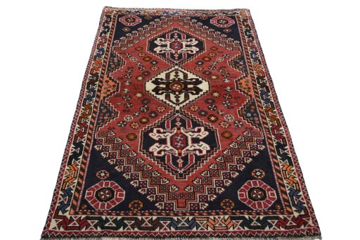Surface texture of 2000s Shiraz rug with natural Wool and intricate pattern