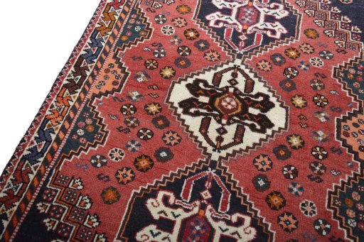 Backside of handmade 2000s Shiraz rug showing knot structure and weave density