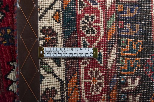 Backside of handmade 2000s Shiraz rug showing knot structure and weave density