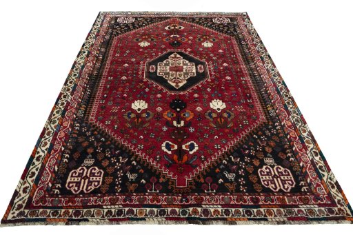 Surface texture of 2000s Shiraz rug with natural Wool and intricate pattern