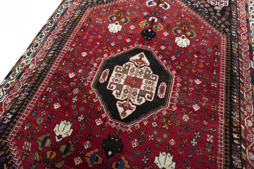 Backside of handmade 2000s Shiraz rug showing knot structure and weave density