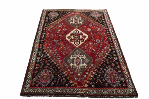 Surface texture of 2000s Shiraz rug with natural Wool and intricate pattern