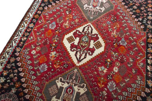 Backside of handmade 2000s Shiraz rug showing knot structure and weave density