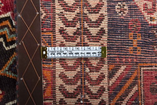 Surface texture of 2000s Shiraz rug with natural Wool and intricate pattern