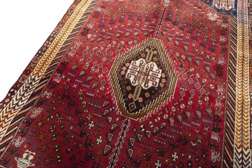 Backside of handmade 2000s Shiraz rug showing knot structure and weave density